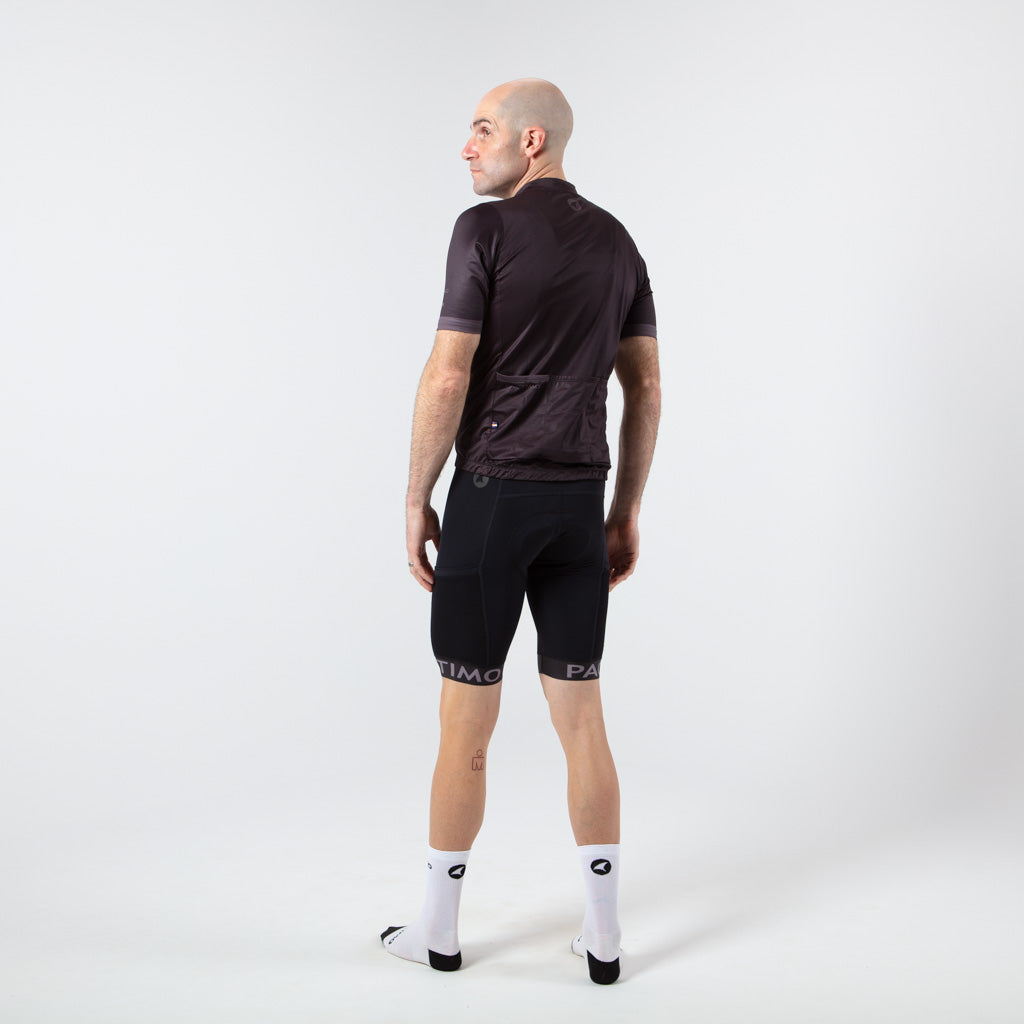 Loose Fit Cycling Jersey - On Body Back View #color_black