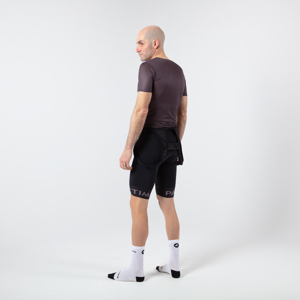 Men's Lightweight Short Sleeve Cycling Base Layer - On Body Back Left View #color_charcoal