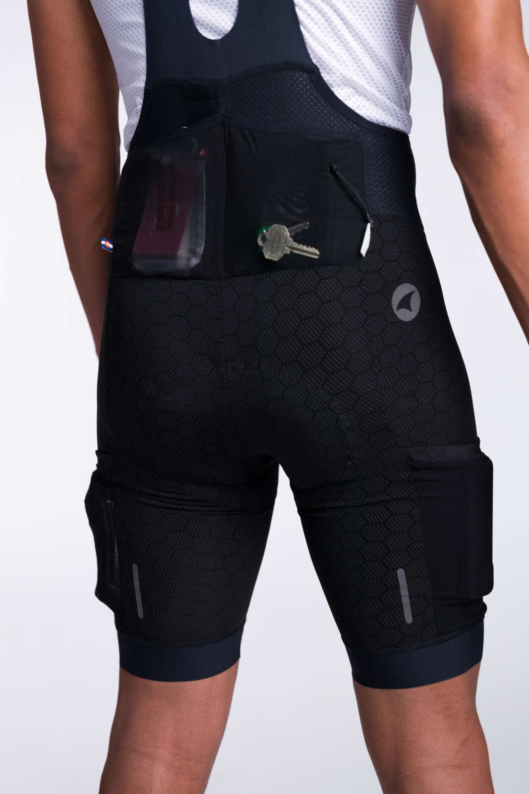 Men's "12-hour" Cargo Bib Shorts - Back Pockets #color_black